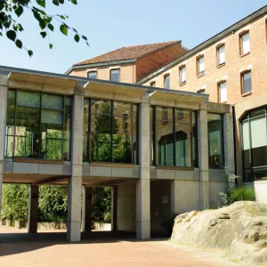 The skybridge connecting Haggard Hall with the Library stands out against the blue sky.