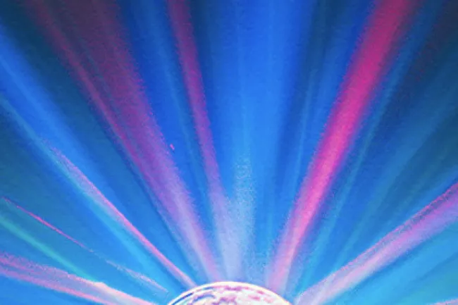 Abstract image of a glowing sphere with vibrant blue and pink light rays radiating outward.